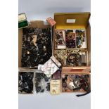 TWO BOXES OF ASSORTED ITEMS, to include a box of black carved cameo pieces, beads and broken