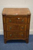A REPRODUCTION MAHOGANY AND CROSSBANDED CHEST OF THREE GRADUATED DRAWERS, with concave front