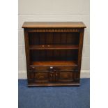 A TITCHMARSH AND GOODWIN OAK OPEN BOOKCASE, with a single shelf, above double cupboard doors,