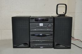 A PHILIPS FW21 MINI HIFI SYSTEM with a matching pair of speakers (CD tray needs attention but works,