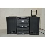 A PHILIPS FW21 MINI HIFI SYSTEM with a matching pair of speakers (CD tray needs attention but works,