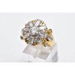 A YELLOW METAL DIAMOND CLUSTER RING, large cluster set with a central round transitional cut