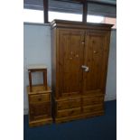 A PINE TWO DOOR WARDROBE, above four drawers, width 120cm x depth 54cm x height 200cm and a matching
