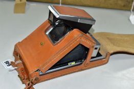 POLAROID SX-70 LAND CAMERA, manual focusing and adjustable exposure control, complete with fitted