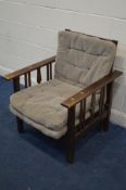 AN ARTS AND CRAFTS OAK CAMPAIGN ARMCHAIR/DAY BED, signed with a trade mark label, reading Tri Una