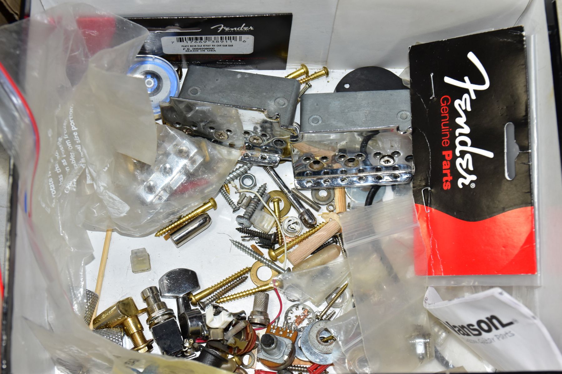 THREE TRAYS CONTAINING GUITAR PARTS, including a 1980 Strat tremolo, 3 scratchplates, a packaged - Image 3 of 6