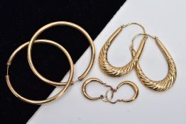 THREE PAIRS OF YELLOW METAL HOOP EARRINGS, the first a pair of textured oval hoop earrings with