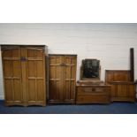 AN OAK FIVE PIECE BEDROOM SUITE, comprising a double door wardrobe, width 128cm x depth 58cm x