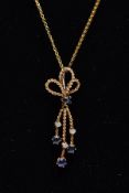 A 9CT GOLD SAPPHIRE AND DIAMOND PENDANT NECKLET, the pendant of a rope twist design set with a