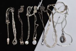 A SELECTION OF WHITE METAL PENDANT NECKLACES AND CHAINS, to include nine in total with designs