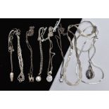 A SELECTION OF WHITE METAL PENDANT NECKLACES AND CHAINS, to include nine in total with designs
