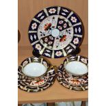 SEVEN PIECES OF ROYAL CROWN DERBY 2451 IMARI PATTERN WARES, comprising two trios and a 21.5cm plate,