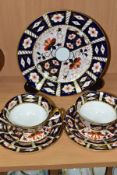 SEVEN PIECES OF ROYAL CROWN DERBY 2451 IMARI PATTERN WARES, comprising two trios and a 21.5cm plate,
