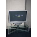 A SONY KZ-42TS1E FLAT SCREEN ANALOGUE TV with stand and remote (PAT pass and working but being