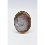 A YELLOW METAL CAMEO BROOCH, the carved abalone shell brooch of oval form depicts a lady in profile,