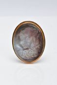 A YELLOW METAL CAMEO BROOCH, the carved abalone shell brooch of oval form depicts a lady in profile,