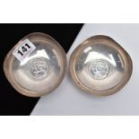 A PAIR OF GEORGE V SILVER DISHES, each silver dish has a wavy rim and is set with a George V 'Stet