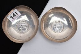 A PAIR OF GEORGE V SILVER DISHES, each silver dish has a wavy rim and is set with a George V 'Stet