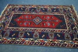 A CAUSCASION KAZAK RUG, with blue and red field, 234cm x 129cm