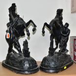 A PAIR OF LATE 19TH CENTURY BLACK PAINTED SPELTER MARLY HORSES, mounted on ebonised wooden plinths