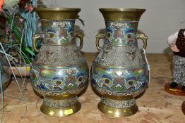 A PAIR OF CHINESE BRASS AND CHAMPLEVE TWIN HANDLED BALUSTER VASES, cast decoration, animal masks