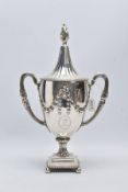 A GEORGE III SILVER TROPHY CUP, of a plain polished design, embossed foliate swag with an engraved