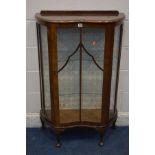 AN EARLY TO MID 20TH CENTURY SERPENTINE WALNUT SINGLE DOOR CHINA CABINET, on cabriole legs, width