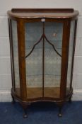 AN EARLY TO MID 20TH CENTURY SERPENTINE WALNUT SINGLE DOOR CHINA CABINET, on cabriole legs, width