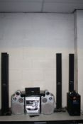 A PANASONIC SA-PT860 DVD SURROUND SOUND SYSTEM with remote, four standing speakers, a sub, centre