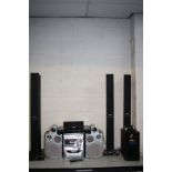 A PANASONIC SA-PT860 DVD SURROUND SOUND SYSTEM with remote, four standing speakers, a sub, centre