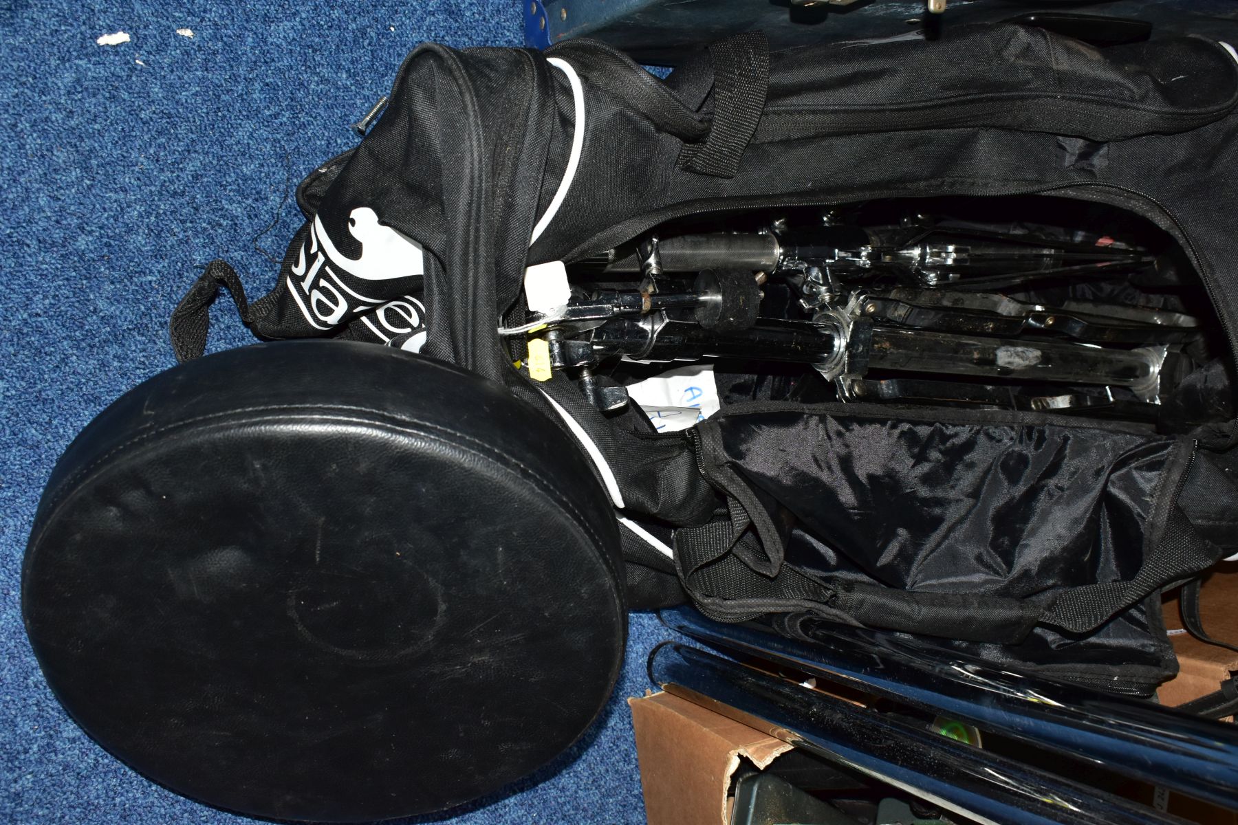 A COLLECTION OF TAMA AND OTHER DRUM HARDWARE in a Slazenger bag, including Tama tom arm, hi hat