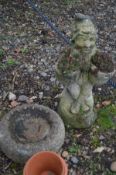 A COMPOSITE GARDEN FIGURE OF A GNOME crossed leg, sitting, holding two small planters, height 56cm