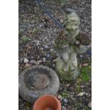 A COMPOSITE GARDEN FIGURE OF A GNOME crossed leg, sitting, holding two small planters, height 56cm