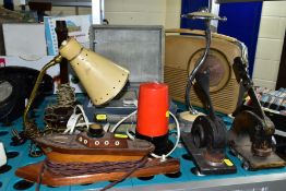 A GROUP OF LAMPS, RADIOS, PAPER EMBOSSERS, etc, including a wooden boat shaped lamp, a Bush radio, a