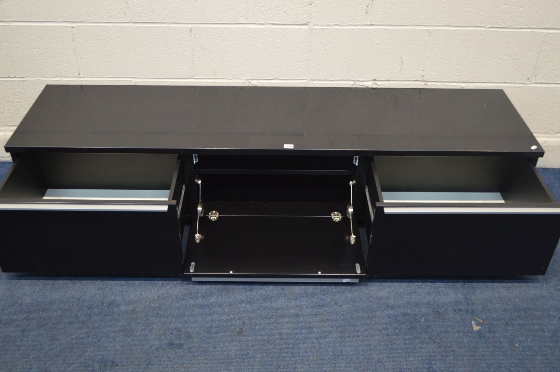 A MODERN BLACK FINISH TV STAND, with two deep drawer flanking a fall front door, width 180cm x depth - Image 3 of 3