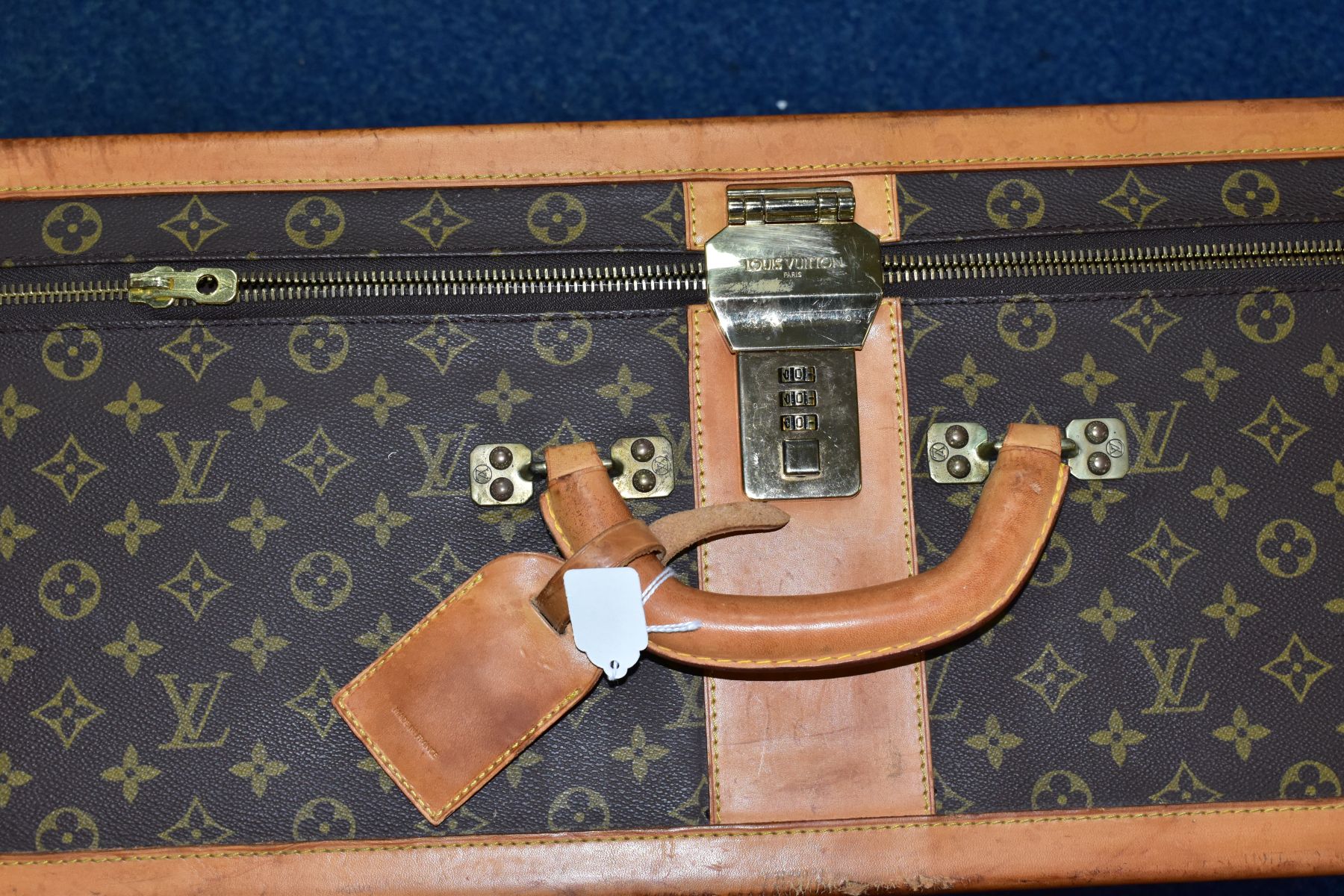 A LOUIS VUITTON MONOGRAM SUITCASE, tan leather trim, with a combination lock (locked, combination - Image 3 of 17