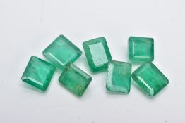 SEVEN LOOSE EMERALD CUT EMERALDS, measuring on average approximately 7.0mm x 5.0mm, combined
