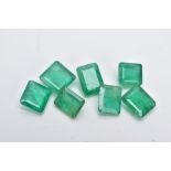 SEVEN LOOSE EMERALD CUT EMERALDS, measuring on average approximately 7.0mm x 5.0mm, combined