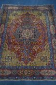 A PERSIAN TABRIZ RUG, woven with floral and foliate motif, and central medallion, 195cm x 147cm (
