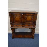 A TITCHMARSH AND GOODWIN JACOBEAN STYLE OAK TWO DOOR CREDENCE CUPBOARD, above two drawers, on turned