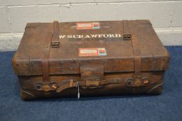 A VINTAGE BROWN LEATHER TRAVELING SUITCASE, with internal tray, bearing travel labels, width 93cm