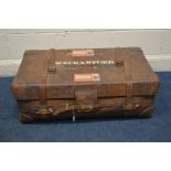 A VINTAGE BROWN LEATHER TRAVELING SUITCASE, with internal tray, bearing travel labels, width 93cm