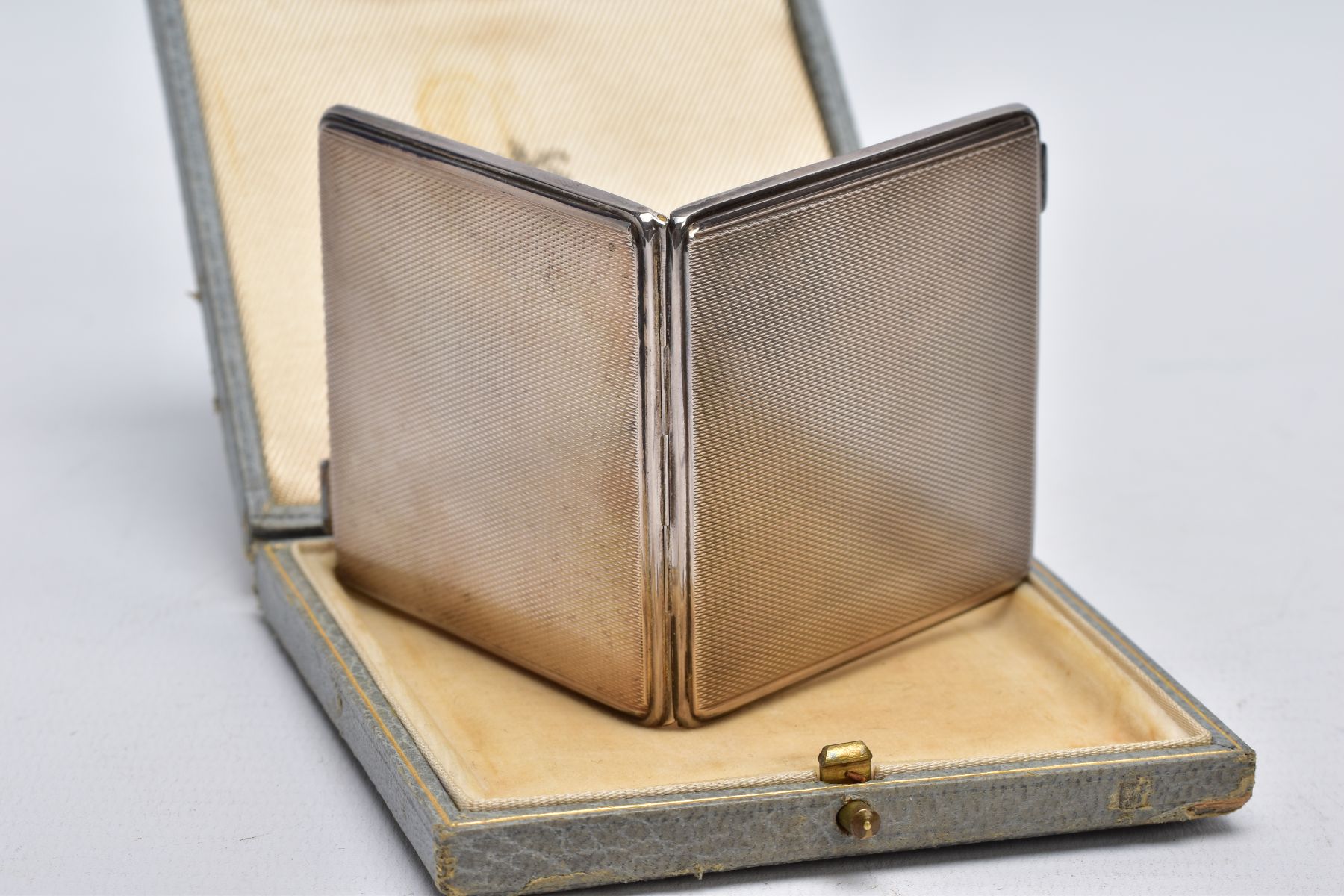 A SILVER COMPACT, square form with an engine turn design, hallmarked Birmingham 1945 'Adie - Image 2 of 4