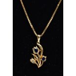 A YELLOW METAL SAPPHIRE AND DIAMOND PENDANT NECKLET, the pendant of a floral design set with two