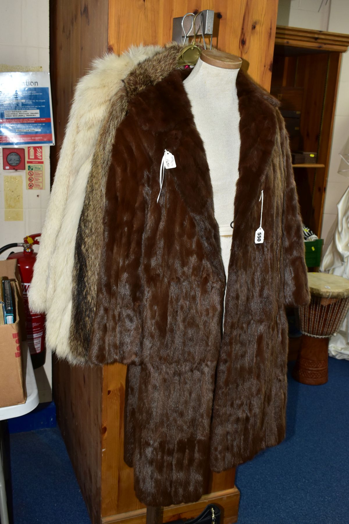 A LADIES SQUIRREL FUR KNEE LENGTH COAT, approximate size 12-14, shawl style collar, pockets, lined