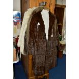 A LADIES SQUIRREL FUR KNEE LENGTH COAT, approximate size 12-14, shawl style collar, pockets, lined