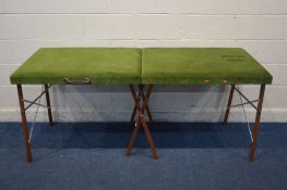 A GREEN UPHOLSTERED FOLDING MASSAGING TABLE