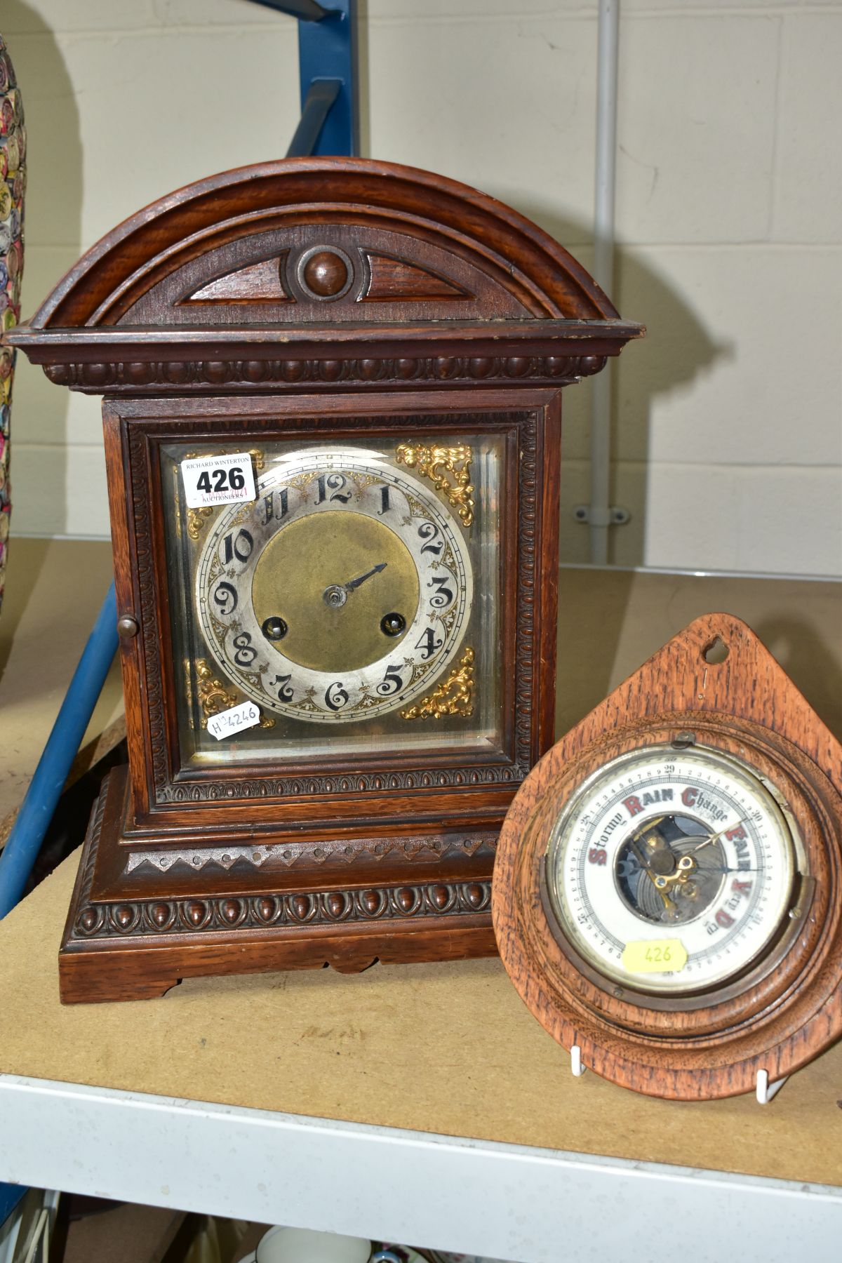 A LATE 19TH CENTURY OAK CASED MANTEL CLOCK, the silvered dial with Arabic numerals, 8 day