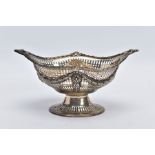 A LATE VICTORIAN SILVER PIERCED BONBON DISH, of an oval form, detailed foliate swags on an