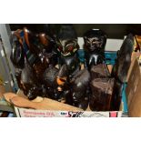 A BOX OF CARVED HARDWOOD TRIBAL ITEMS, ETC, including African busts, wall plaques, etc, butter pats,